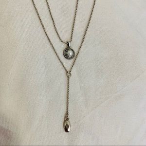 Simple silver necklace with small pearl accent